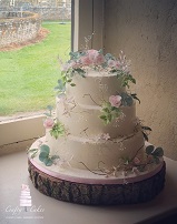 Rustic buttercream 3 tier wedding cake with sugar flowers